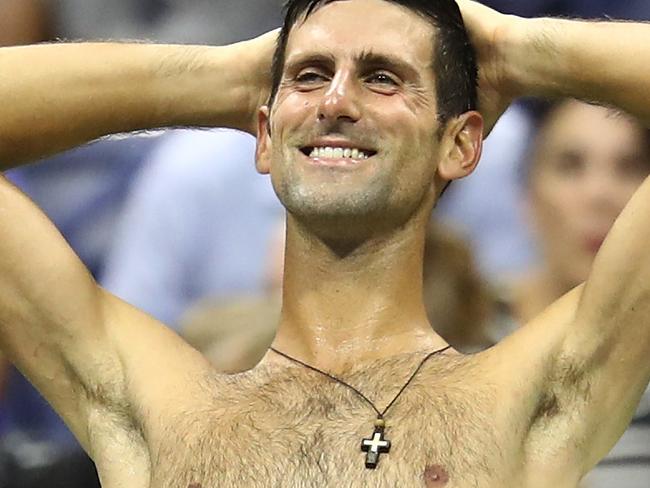 NEW YORK, NY - SEPTEMBER 05:  Novak Djokovic of Serbia reacts during break in play in his men's singles quarter-final match against John Millman of Australia on Day Ten of the 2018 US Open at the USTA Billie Jean King National Tennis Center on September 5, 2018 in the Flushing neighborhood of the Queens borough of New York City.  (Photo by Julian Finney/Getty Images) *** BESTPIX ***