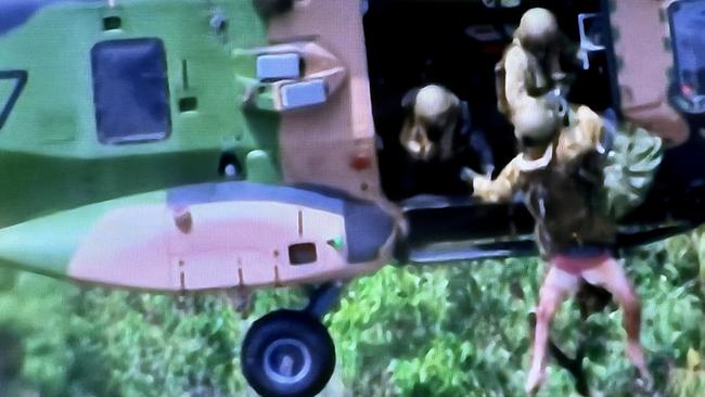 SKY TV frame grabs of a live rescue from the top of a roof in Lismore by the defence force.