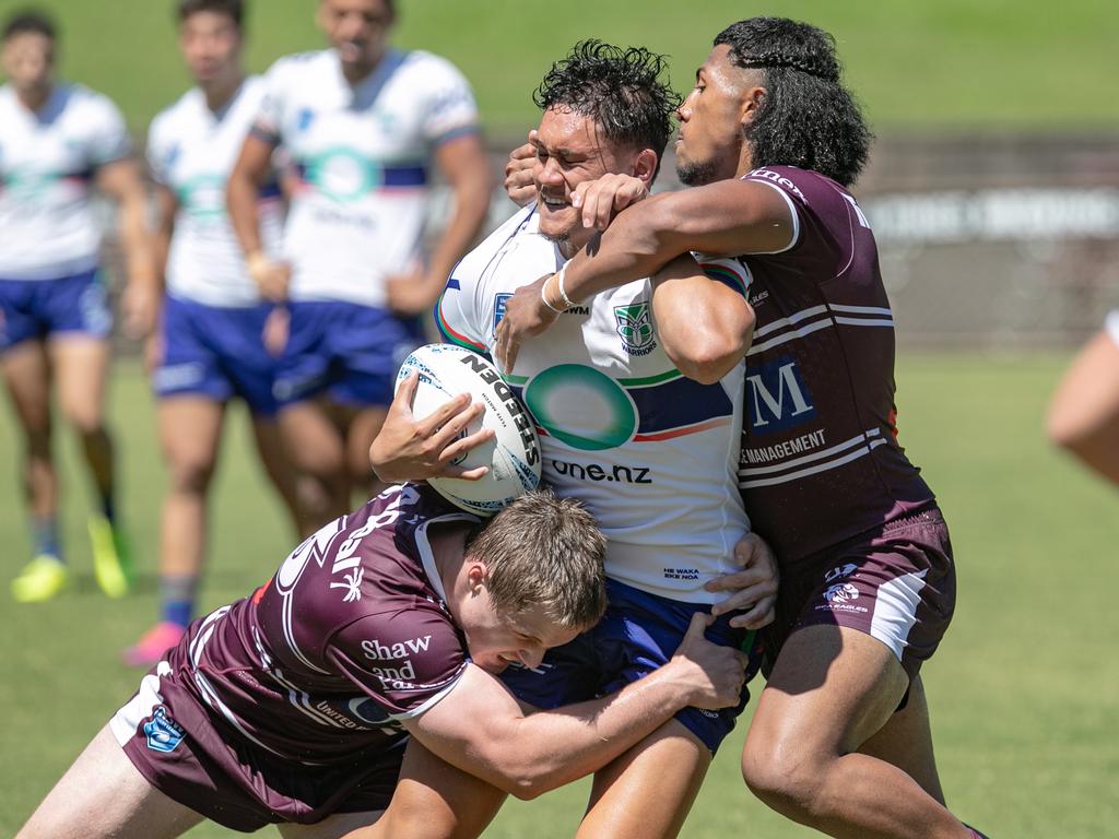 Zaidas Muagututia tackles Kahu Capper. Picture: Julian Andrews