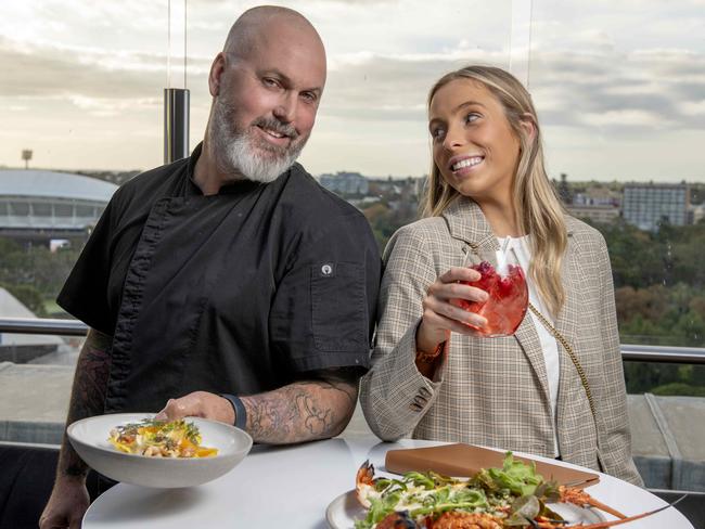 19/5/22 - To promote delicious. Month Out. As part of the campaign, 2KW is offering a free gin to diners on arrival for those who register. Anna Pryor with a gin and tonic and with chef Trent Lymn. Picture: Naomi Jellicoe