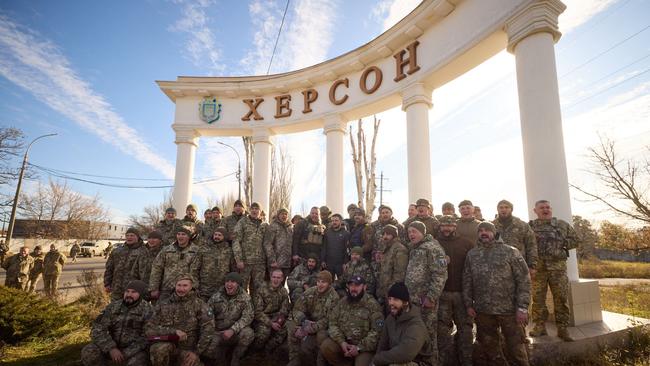 Ukrainian President Volodymyr Zelenskyy posing for a group photo with Ukrainian servicemen during his visit to the newly liberated city of Kherson. Picture: AFP