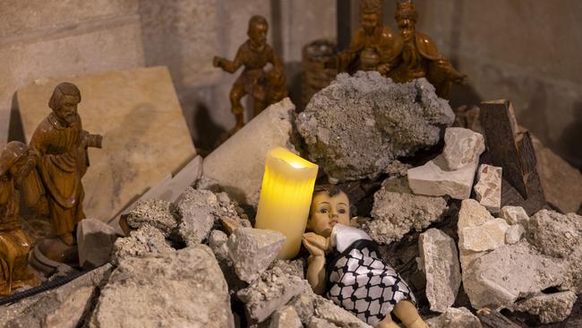 The Nativity scene showing baby Jesus wrapped in a keffiyeh and placed in rubble to show solidarity with the people of Gaza in the Evangelical Lutheran Christmas Church in Bethlehem. Picture: Getty Images.