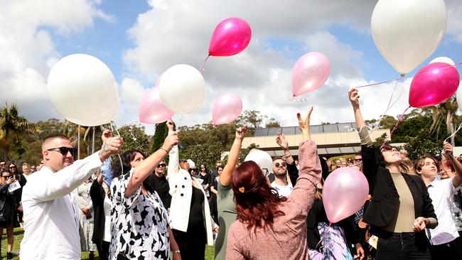 Friends and family released pink balloons in memory of the young mother. Picture: Peter Lorimer.