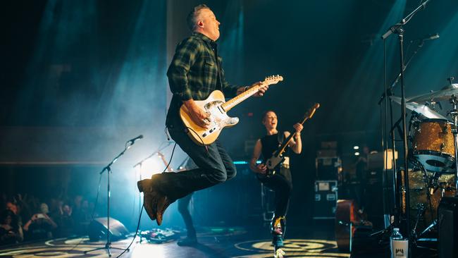 Jason Isbell is airborne as Anna Butters looks on. Picture: John Weichman