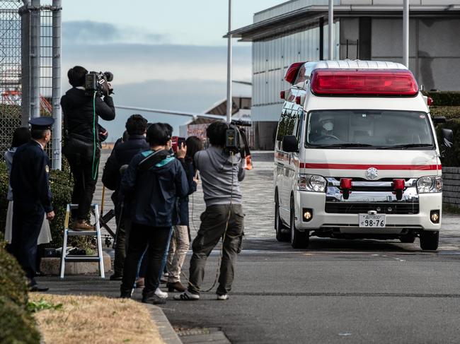 An ambulances carrying a Japanese citizen repatriated from Wuhan who has shown flu-like symptoms during in-flight screening for coronavirus in Tokyo, Japan. Picture: Carl Court/Getty