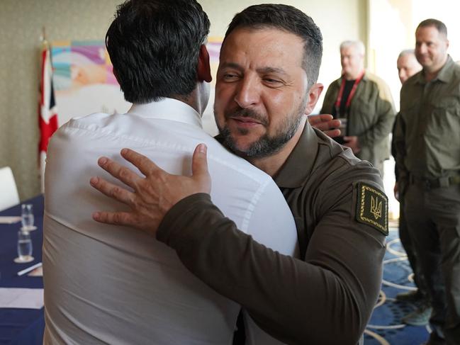 Britain's Prime Minister Rishi Sunak (left) and Ukraine's President Volodymyr Zelensky embrace during the G7 Leaders' Summit in Hiroshima. Picture: Stefan Rousseau / POOL / AFP