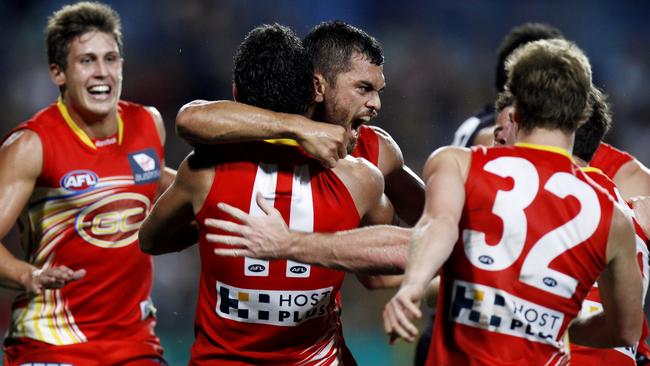 Karmichael Hunt celebrates the most famous moment of his AFL career.