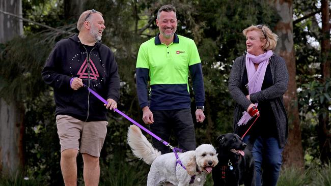 Mr Pumpa with the dogs’ owners Blake and Louise Edwards. Picture: Toby Zerna