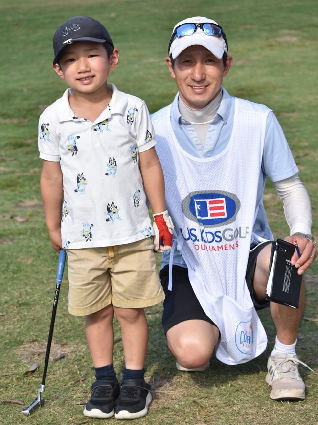 Toowoomba's Kogen Yoshida (boys six years and under) with Kenji Yoshida at the US Kids Golf Foundation Australian Open at the Rockhampton Golf Club on September 27.
