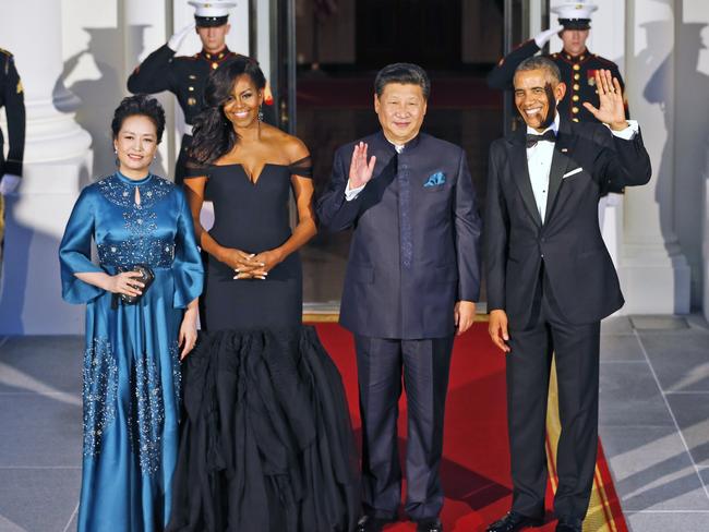 US President Barack Obama (right) and Chinese President Xi Jinping with their wives as they arrive for a State Dinner at the White House on Friday after announcing a joint statement on climate change. Picture: AP/Steve Helber