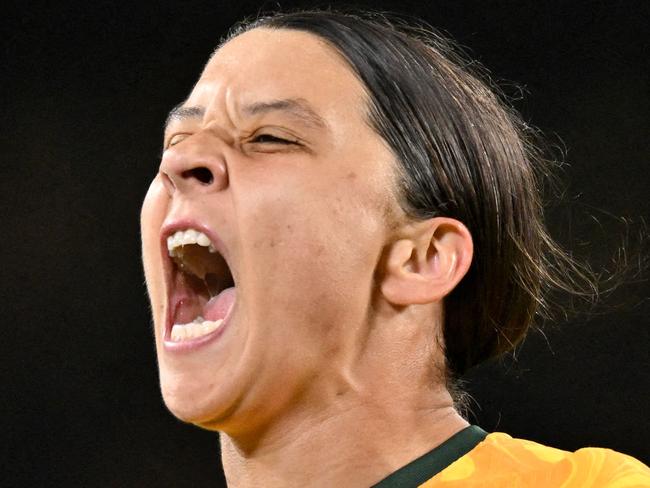 FILES-- This file photo taken on August 16, 2023 shows Australia's forward Sam Kerr celebrating scoring her team's first goal during the Australia and New Zealand 2023 Women's World Cup semi-final football match between Australia and England at Stadium Australia in Sydney. Chelsea and Australian women's football star Sam Kerr has been charged with a "racially aggravated offence" in Britain following a dispute involving a police officer, London's Metropolitan Police said March 4. The 30-year-old striker, one of the highest profile and best-paid players in the women's game, was charged following an incident in London in January 2023, a police statement read. (Photo by IZHAR KHAN / AFP)