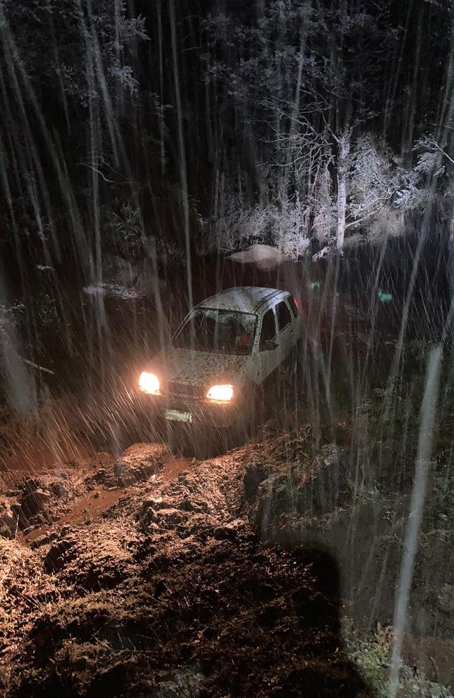 Police rescue driver and passengers stuck in snow at Lachlan. Pic: Tasmania Police.