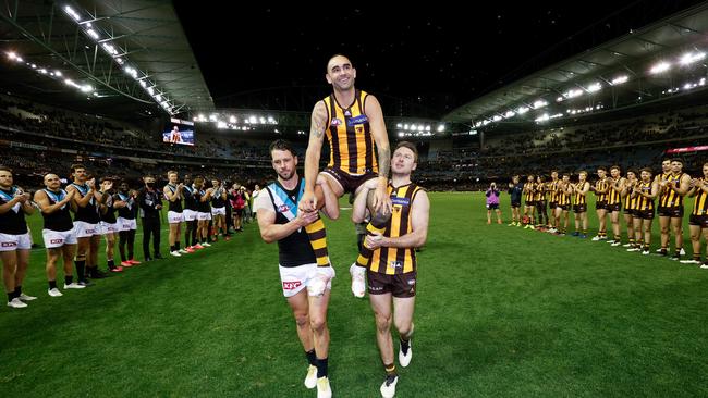 Shaun Burgoyne was chaired off by Travis Boak and Liam Shiels after his 400th career game. Picture: Michael Willson/AFL Photos via Getty Images