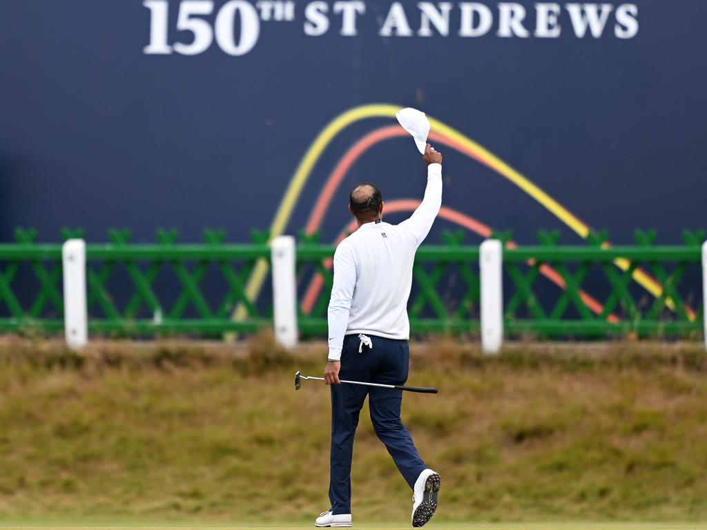 Woods acknowledges his fans as he farewells St Andrews, missing the cut in the 150th Open. Picture: Ross Kinnaird/Getty Images