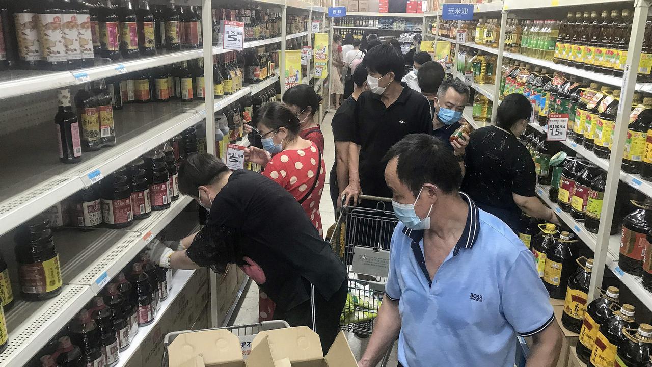 Shelves are stripped amid the new outbreak. Picture: STR / AFP) / China OUT.