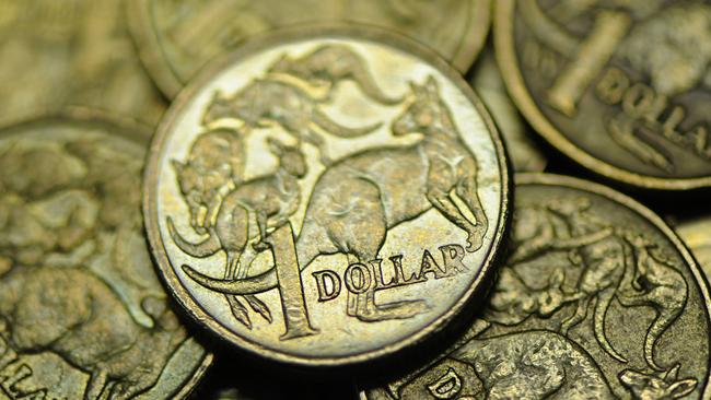 Close-up of used Australian one dollar coin photographerd in Melbourne, Wednesday, June 13, 2012. Reserve Bank of Australia governor Glenn Stevens today said there are big benefits to Australian's as consumers from the high Aiustralian dollar (AUD). (AAP Image/Julian Smith) NO ARCHIVING