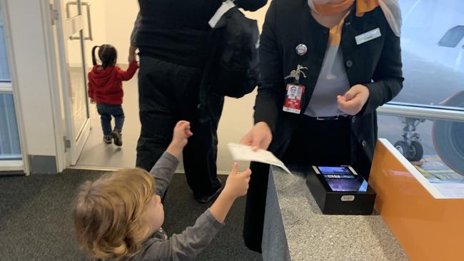 The author's son boarding the 2019 flight (from hell).