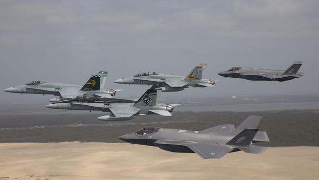 RAAF F/A-18 Hornets fly in formation with a pair of F-35A Joint Strike Fighters. Picture: Supplied