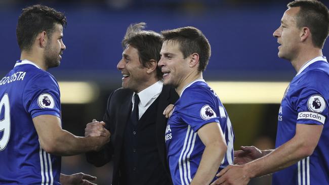 Chelsea's manager Antonio Conte congratulates Chelsea's Diego Costa, left, Cesar Azpilicueta, second right, and John Terry.