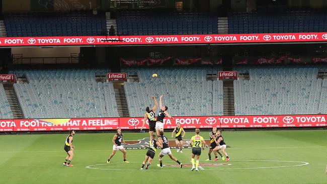 The first bounce of the Richmond v Carlton season-opening in front of empty seats at the MCG. Picture: Michael Klein