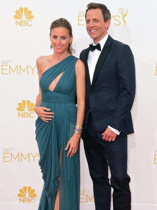 Alexi Ashe and Seth Meyers arrive on the red carpet for the 66th Emmy Awards.