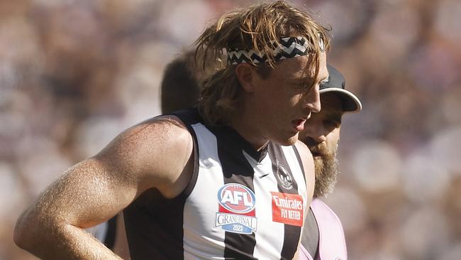 MELBOURNE, AUSTRALIA - SEPTEMBER 30: Nathan Murphy of the Magpies leaves the field with trainers during the 2023 AFL Grand Final match between Collingwood Magpies and Brisbane Lions at Melbourne Cricket Ground, on September 30, 2023, in Melbourne, Australia. (Photo by Daniel Pockett/AFL Photos/via Getty Images)