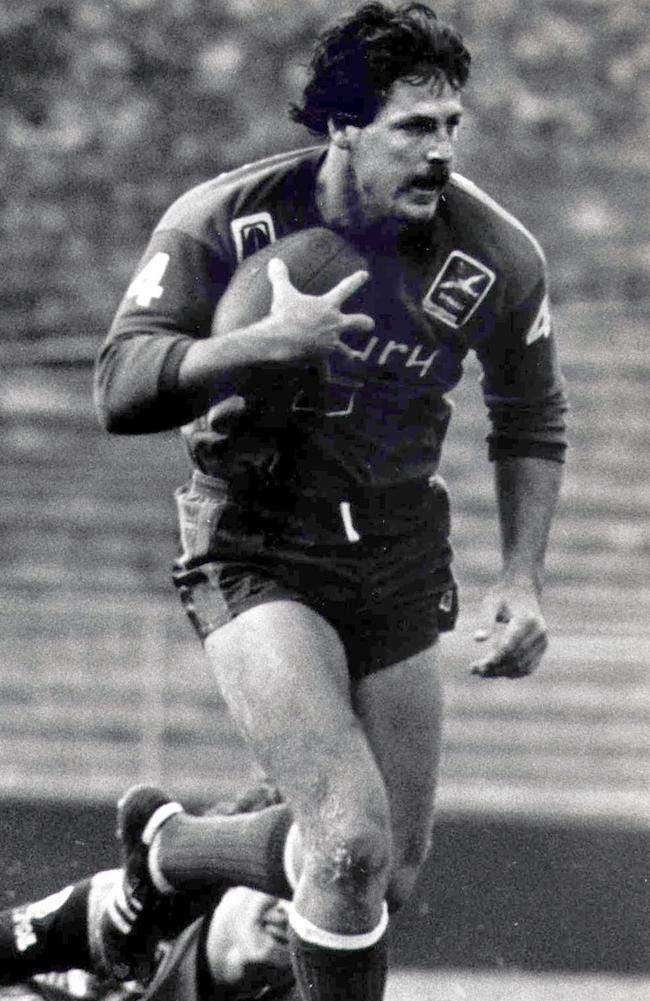 Gene Miles runs the ball for Wynnum Manly.