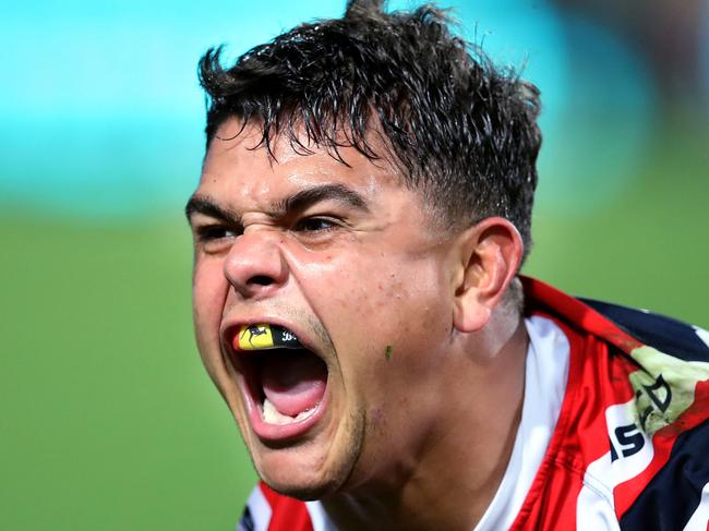 Latrell Mitchell celebrates scoring a try against the Bulldogs.