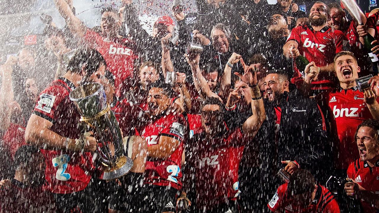 Crusaders players celebrate their victory after the 2018 Super Rugby final.