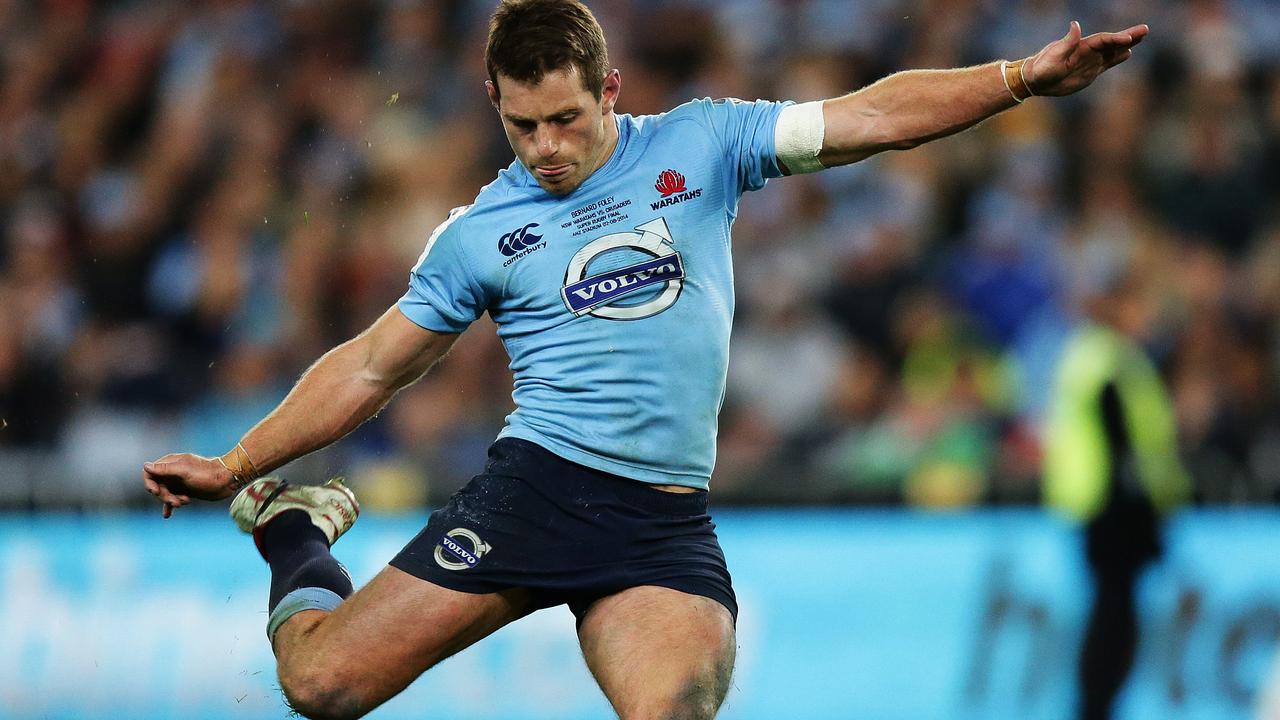 Waratahs Bernard Foley kicks the winning penalty goal during the Waratahs v Crusaders Super Rugby Final at ANZ Stadium, Sydney. Pic Brett Costello