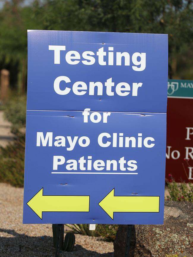 Signs direct arriving cars to a coronavirus screening area at a testing site in a parking lot at Mayo Clinic in Phoenix, Arizona. Picture: Christian Petersen/Getty Images