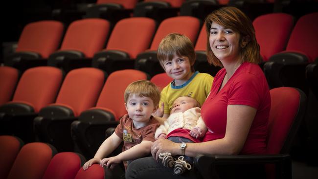 Dr Julia Shore has just graduated with a PhD in mathematics with her children Christopher 2, Benjamin 4 and Amberlynn 7weeks at the UTAS Sir Stanley Burbury Theatre. Picture: Chris Kidd