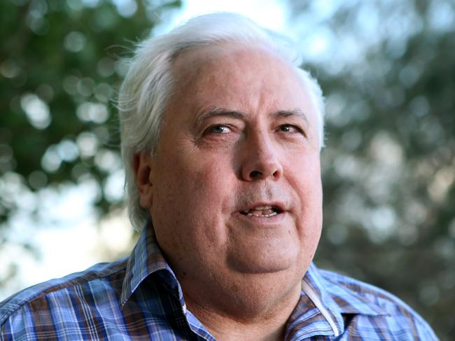 Clive Palmer talks to the media on the Esplanade at Paradise Point, Gold Coast. Pic Jono Searle.