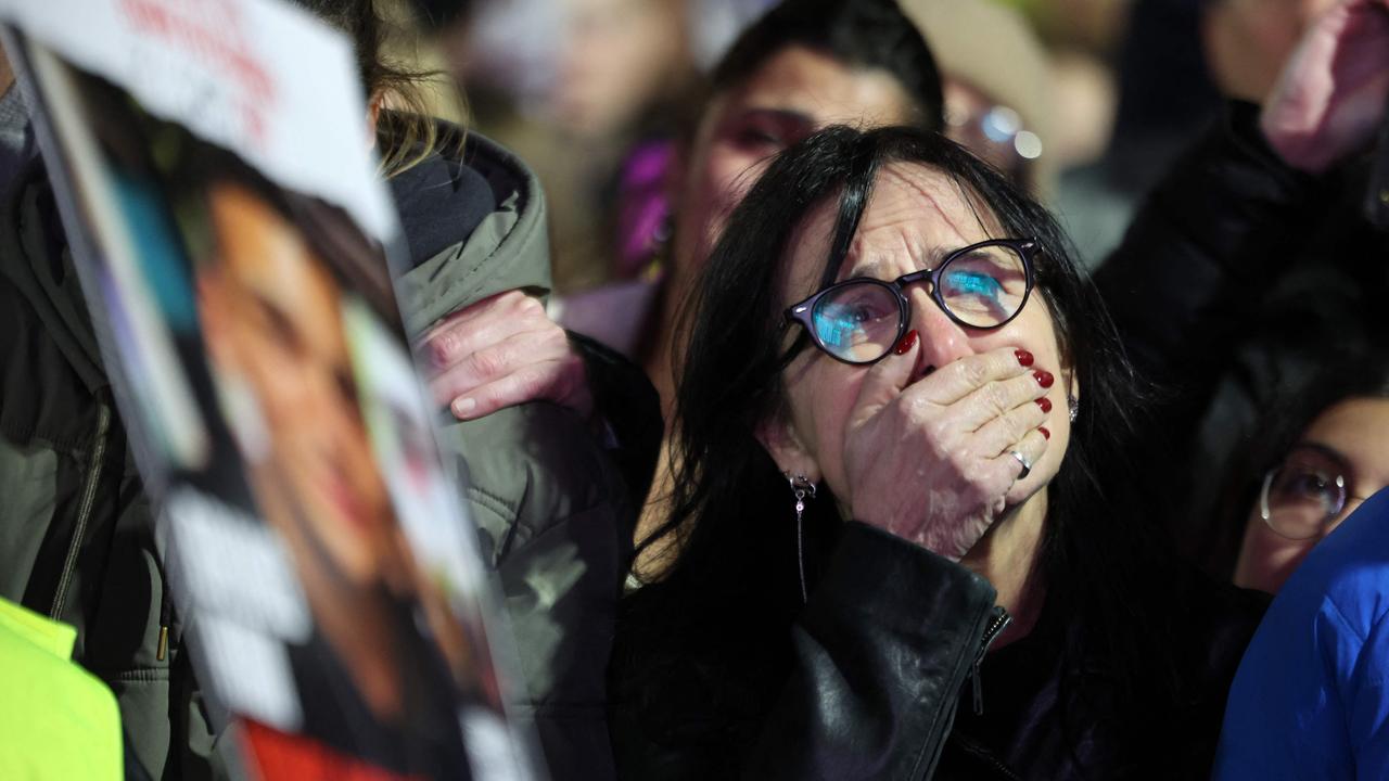 A woman reacts as crowds gather at hostage square in Tel Aviv. Picture: Jack GUEZ / AFP