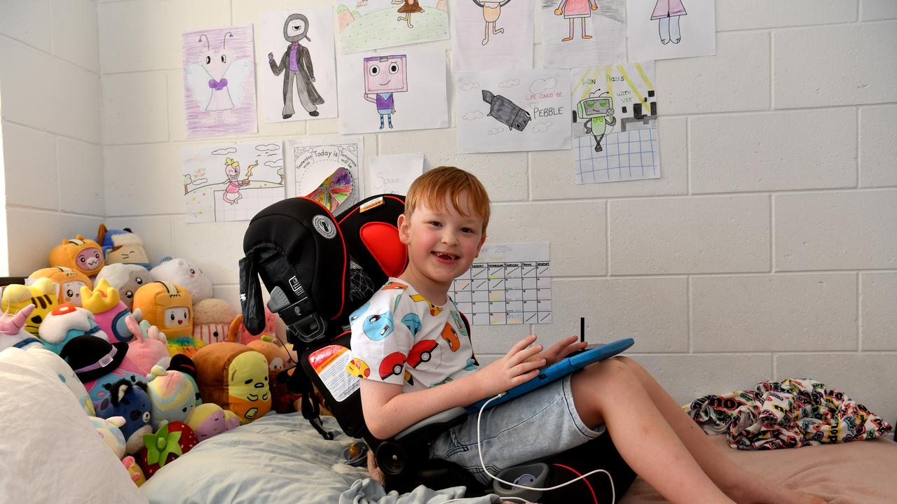 Connor sits in their new car seat, on his bed, which arrived today. Hermit Park mum Bianca Burns says her 6-year-old special needs son Connor has been barely sleeping after thieves broke into their home and stole their car before torching it later on. Picture: Evan Morgan