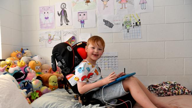 Connor sits in their new car seat, on his bed, which arrived today. Hermit Park mum Bianca Burns says her 6-year-old special needs son Connor has been barely sleeping after thieves broke into their home and stole their car before torching it later on. Picture: Evan Morgan