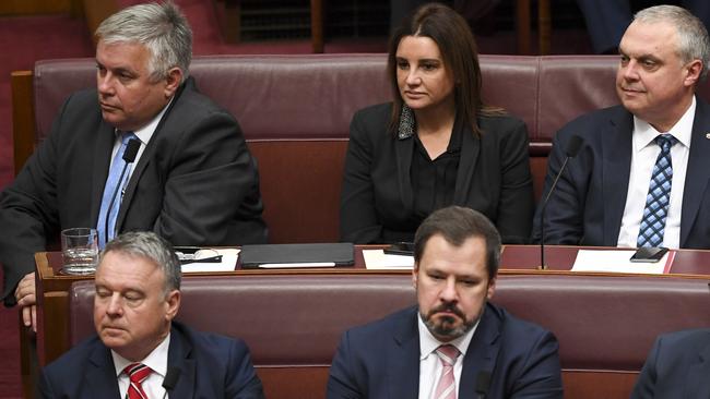 Jacqui Lambie (centre) sits with Centre Alliance Senator Rex Patrick (left) and Stirling Griff during the official opening of the 46th Federal Parliament yesterday. Picture: AAP.