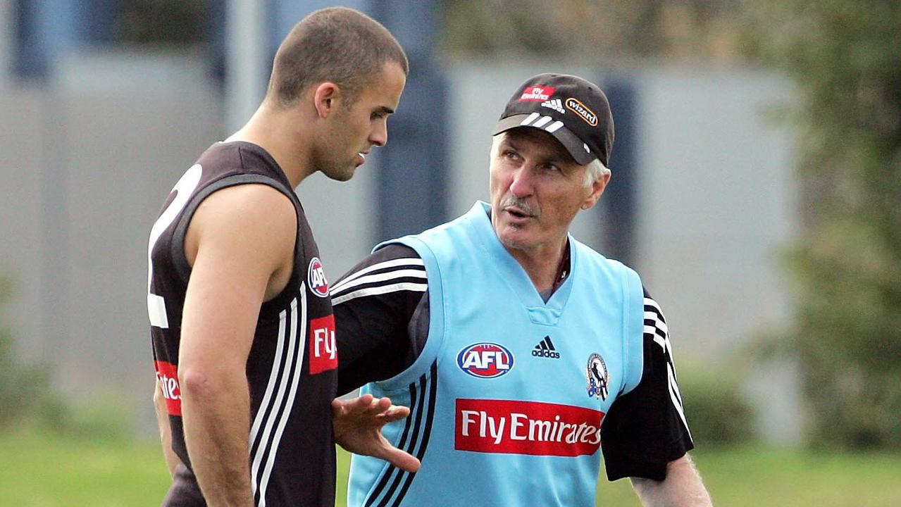 Mick Malthouse works with Rhyce Shaw during his playing days.