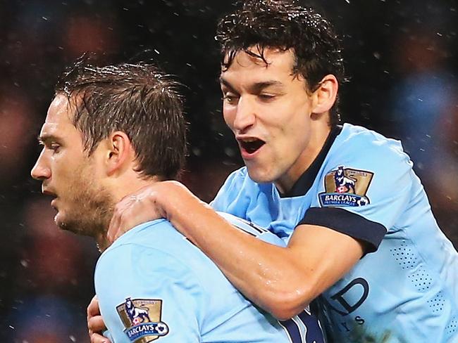 MANCHESTER, ENGLAND - JANUARY 01: Frank Lampard of Manchester City celebrates his team's third goal with Jesus Navas during the Barclays Premier League match between Manchester City and Sunderland at Etihad Stadium on January 1, 2015 in Manchester, England. (Photo by Alex Livesey/Getty Images)