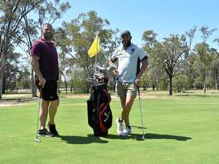 CHIPPING IN: Former National Rugby League players Michael Crocker and Chris Walker had a quick putt at the Roma Golf Club, lending their support to the Men of League charity tournament on the weekend. Picture: Jorja McDonnell