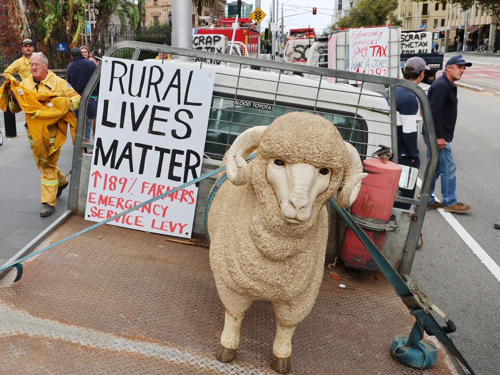 Farmers and CFA members protest in front of the Victorian parliament. Picture: David Crosling