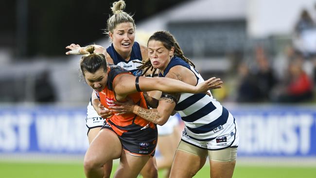 Jessica Dal Pos tries to break away from a couple of Cats. Pic: AAP 