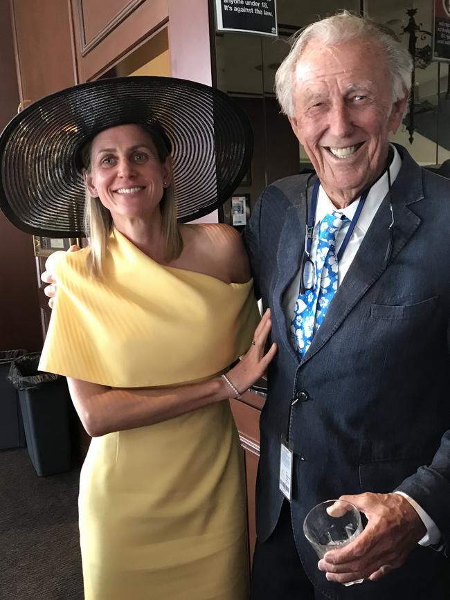 John Singleton and his new wife Sarah Warry at the races.