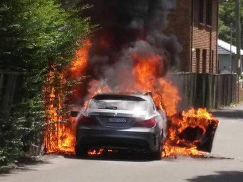 A car on fire in Chandler St, Kogarah, believed to be involved in the Mick Hawi shooting. Picture: Claude Nunes