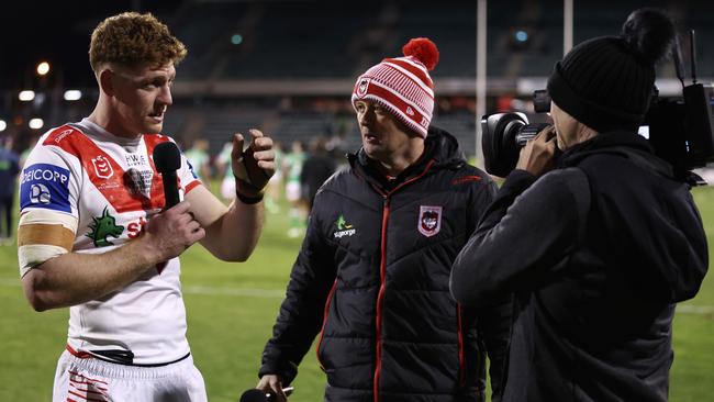 WOLLONGONG, AUSTRALIA - JULY 07:  Dan Russell of the Dragons is interviewed by a Dragons club personnel after the round 19 NRL match between St George Illawarra Dragons and Canberra Raiders at WIN Stadium on July 07, 2023 in Wollongong, Australia. (Photo by Matt King/Getty Images)