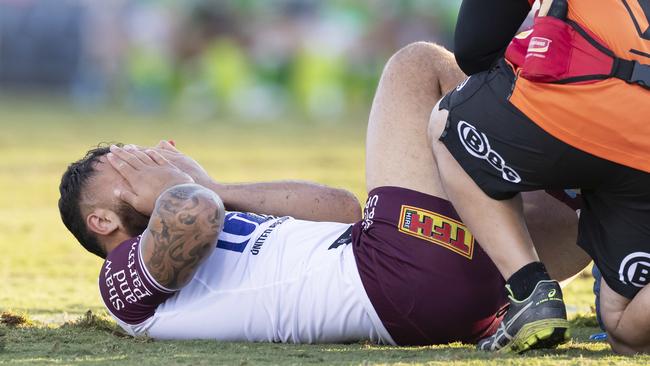 Dylan Walker of the Sea Eagles is injured in a tackle by Canberra’s Elliott Whitehead. Picture: AAP