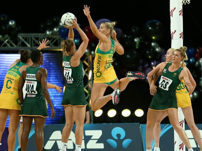 Courtney Bruce goes up to block shooter Maryka Holtzhausen in Saturday’s Test aganst South Africa.