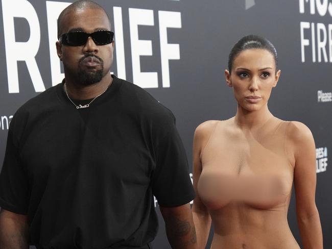 EDS NOTE: NUDITY - Kanye West, left, and Bianca Censori arrive at the 67th annual Grammy Awards on Sunday, Feb. 2, 2025, in Los Angeles. (Photo by Jordan Strauss/Invision/AP)