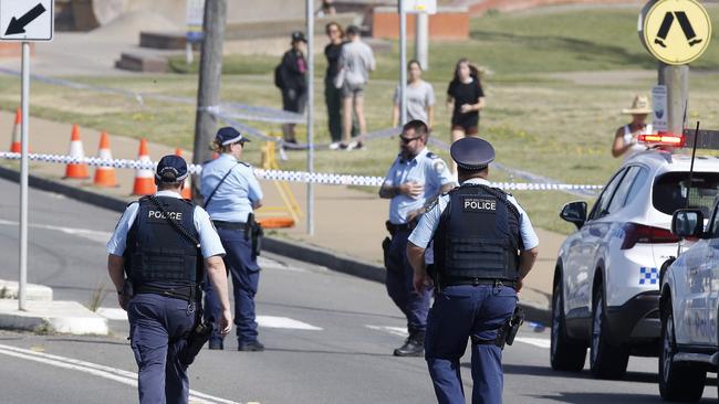 Police at the crime scene in Bar Beach car park. Picture: NewsWire / John Appleyard
