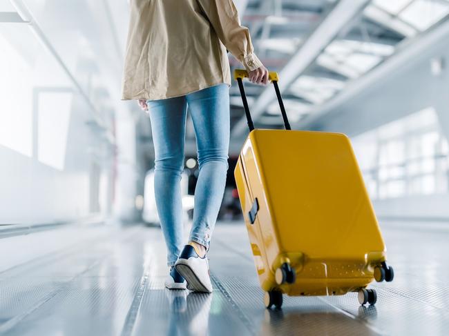 International airport terminal. Asian beautiful woman with luggage and walking in airport.Escape 29 October 2023Travel updatesPhoto - iStock